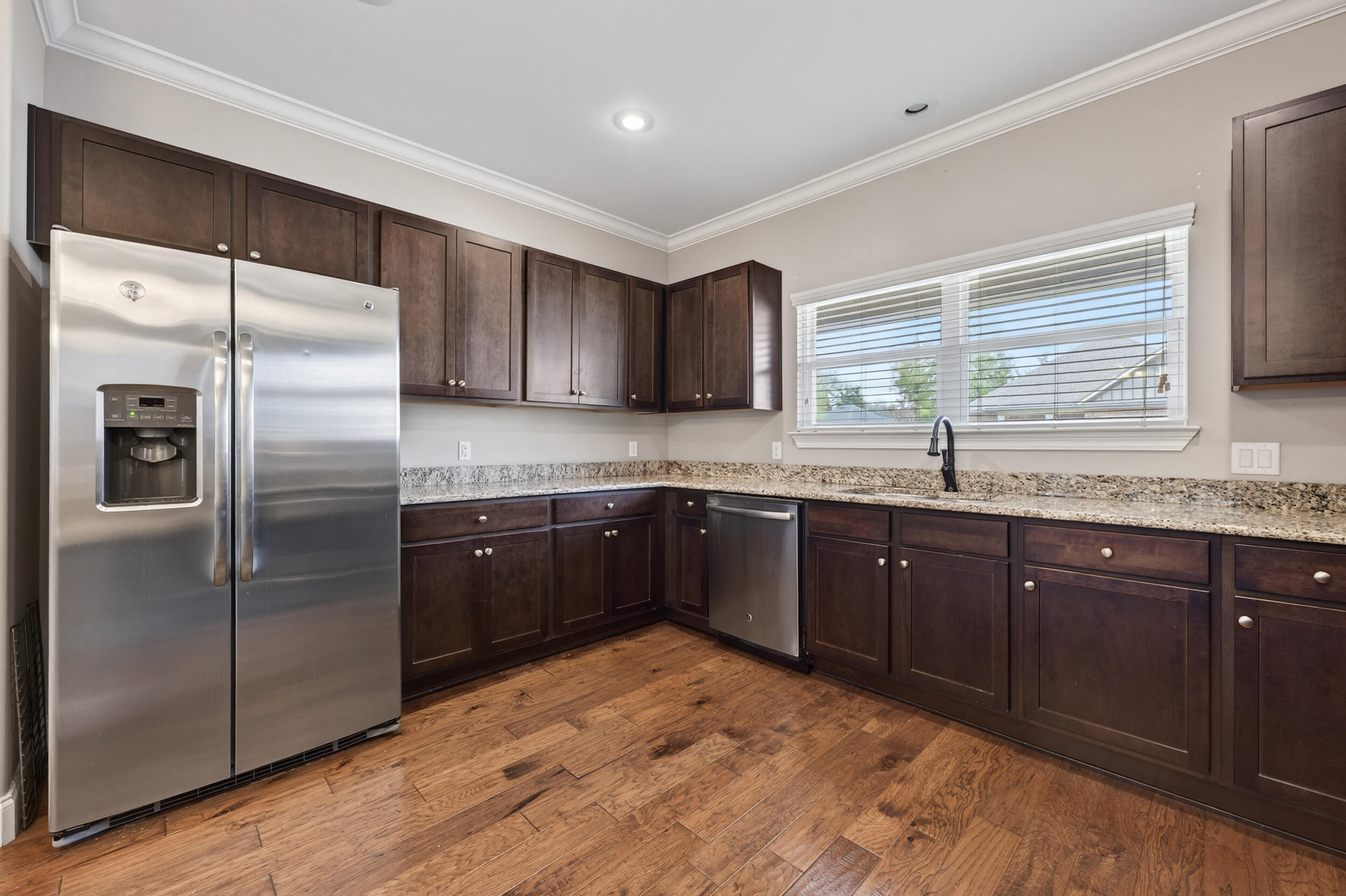 106 Arrowhead Way Niceville, FL 32578 - Photo 15 of 39 a kitchen with stainless steel appliances granite countertop a refrigerator and a sink