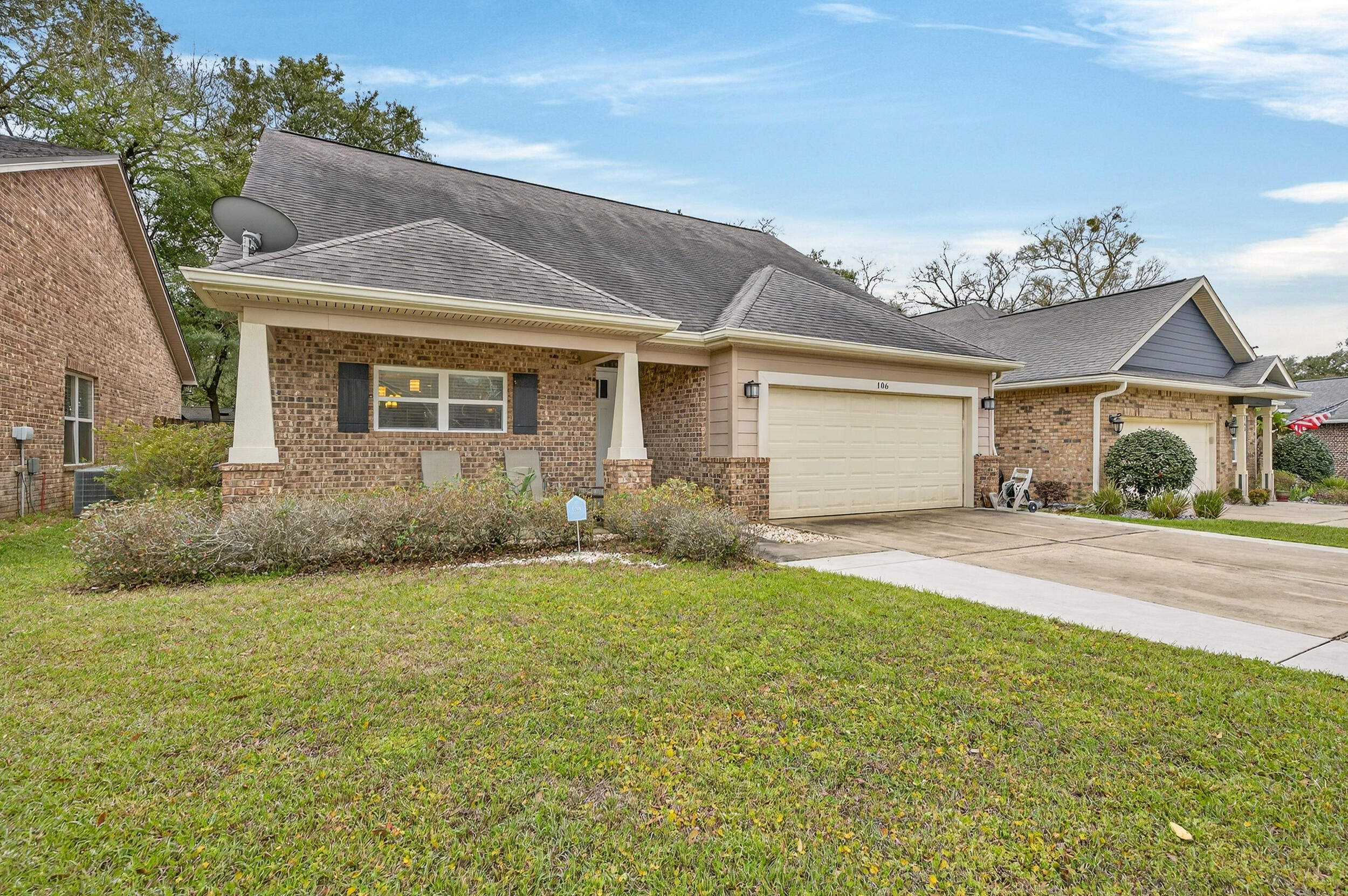 106 Arrowhead Way Niceville, FL 32578 - Photo 2 of 39 a front view of a house with a yard