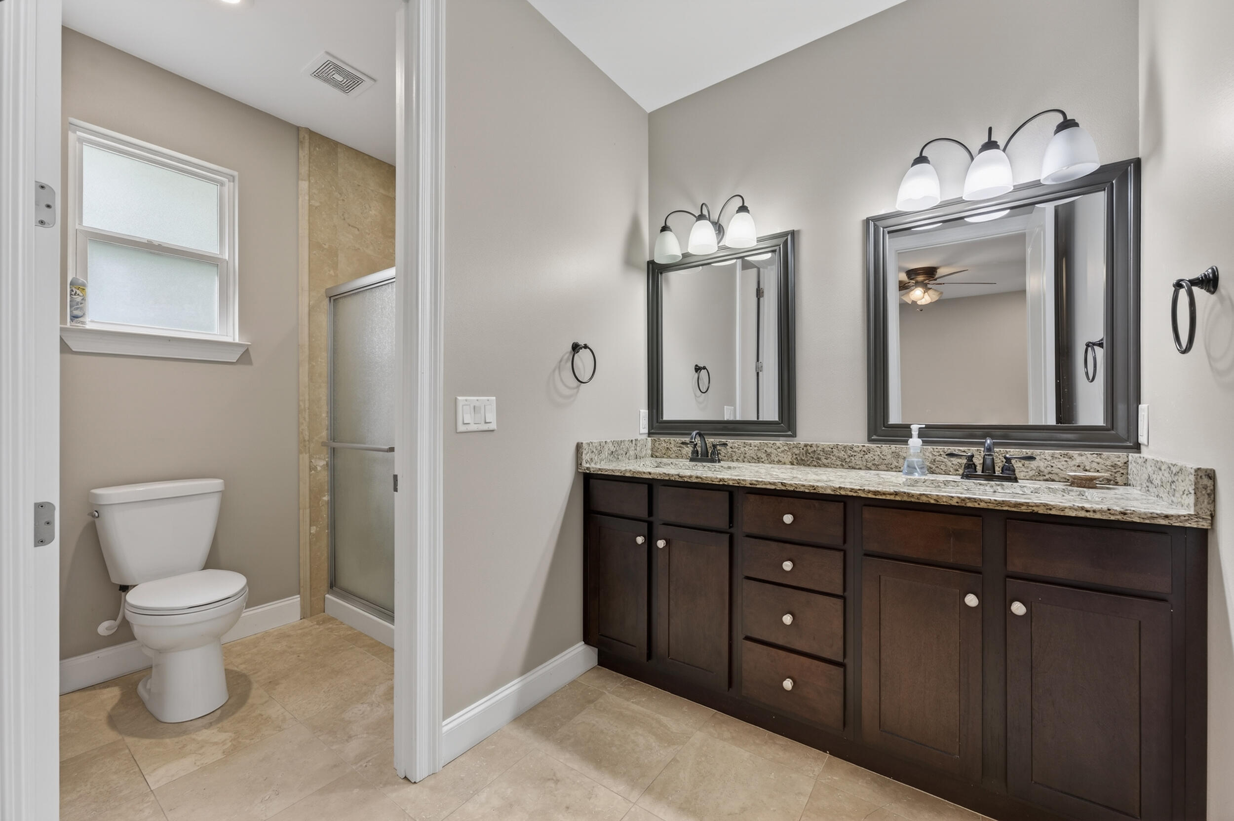 106 Arrowhead Way Niceville, FL 32578 - Photo 21 of 39 a bathroom with a granite countertop sink and a mirror