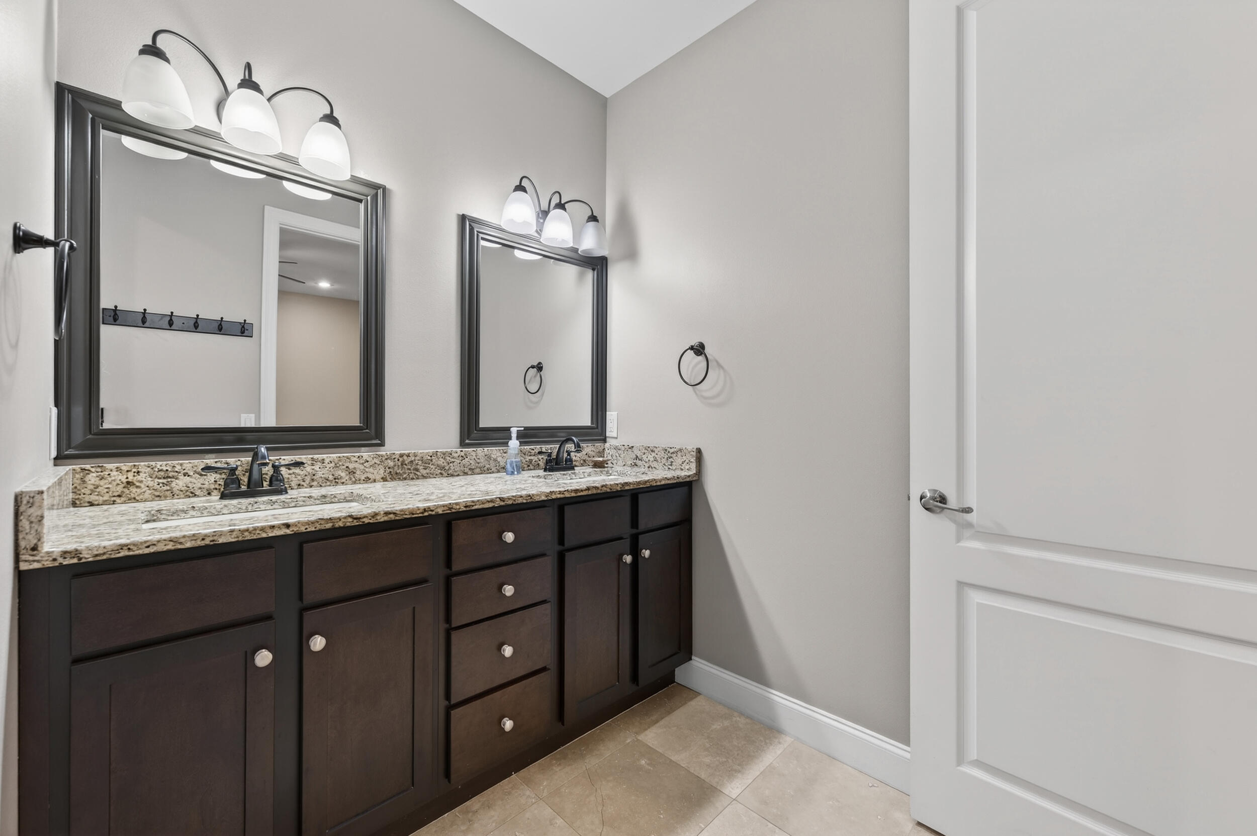 106 Arrowhead Way Niceville, FL 32578 - Photo 23 of 39 a bathroom with a double vanity sink and a mirror