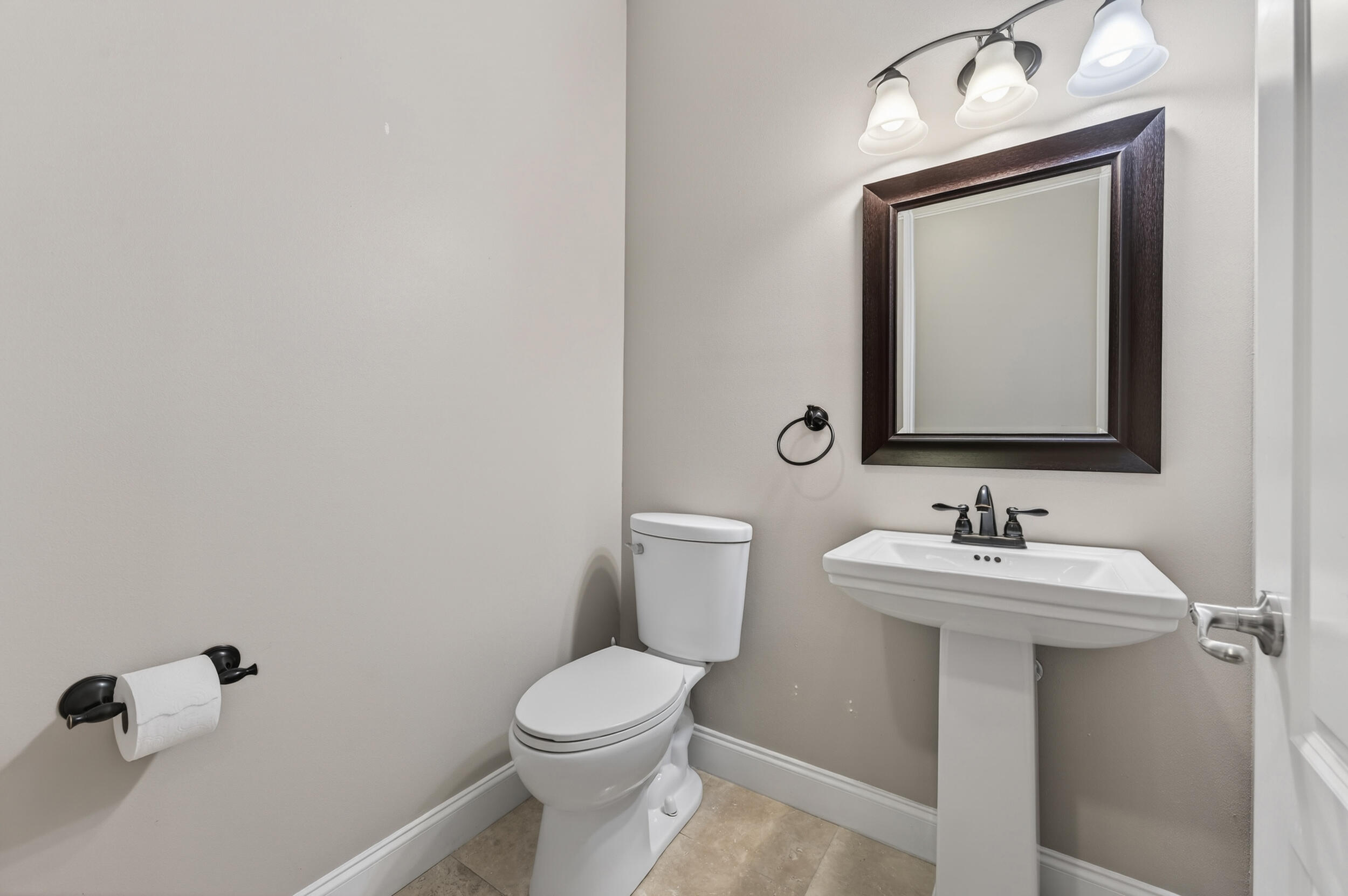 106 Arrowhead Way Niceville, FL 32578 - Photo 25 of 39 a bathroom with a toilet sink and mirror