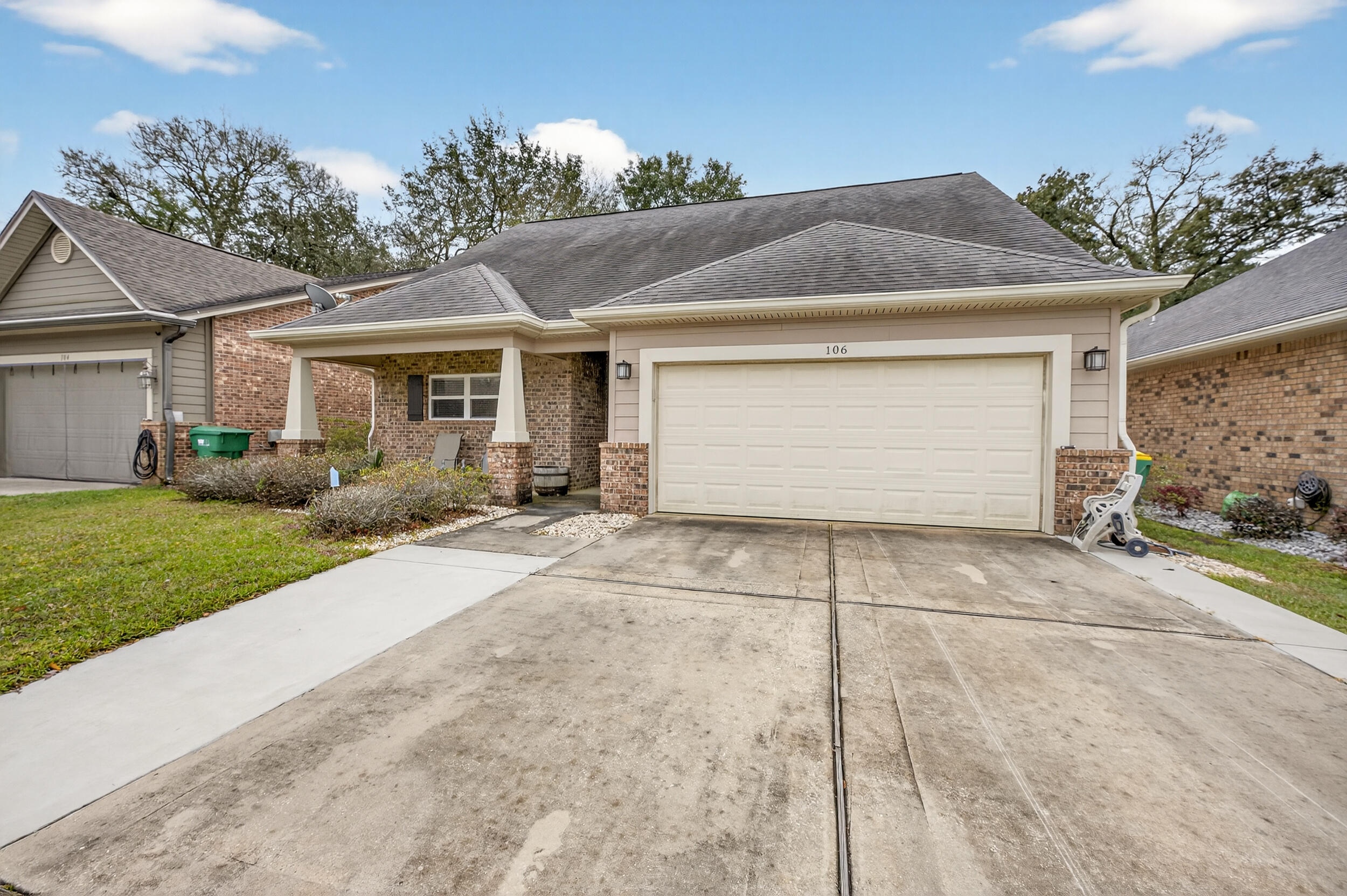 106 Arrowhead Way Niceville, FL 32578 - Photo 3 of 39 a front view of house with yard and trees around