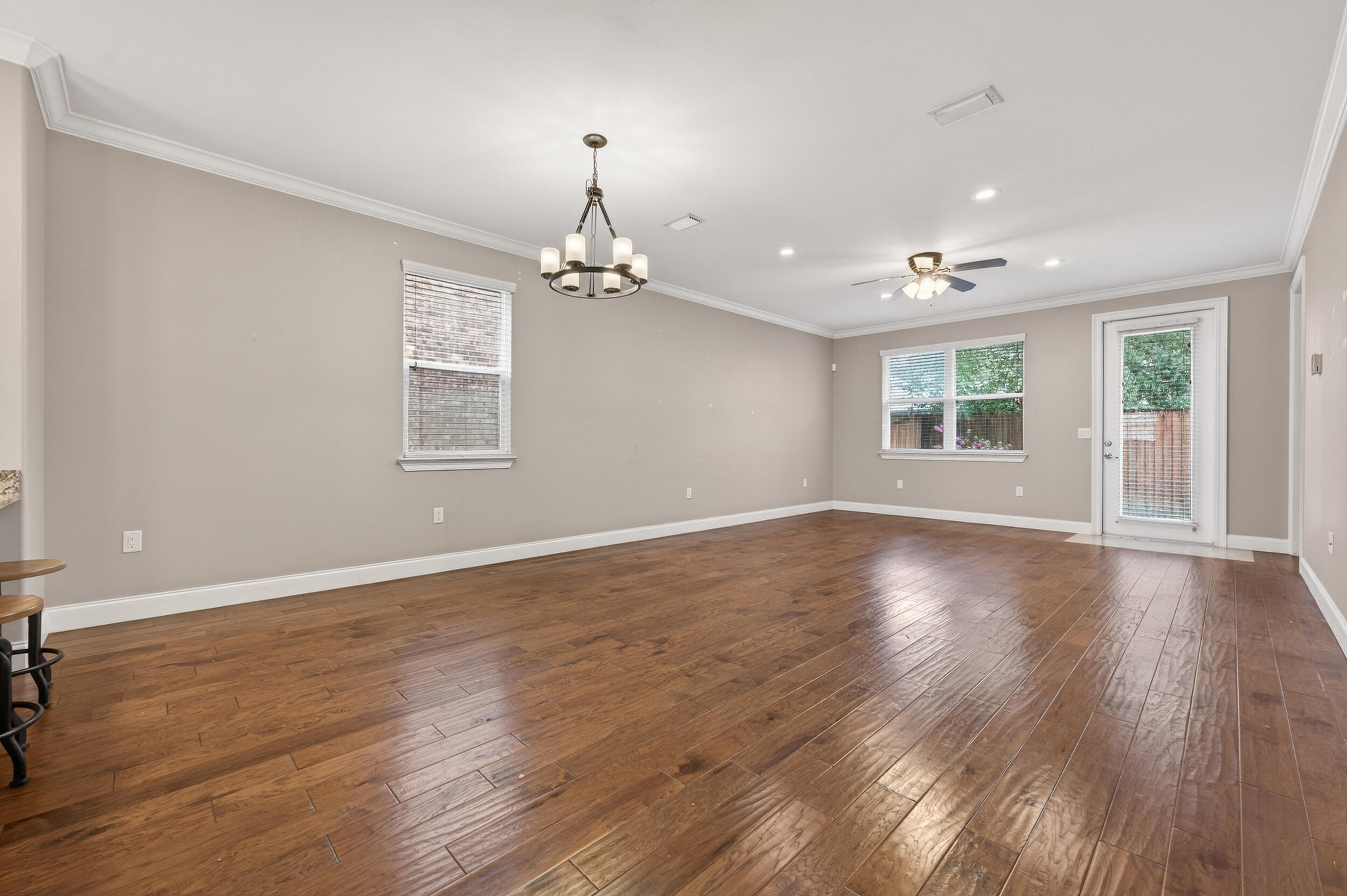 106 Arrowhead Way Niceville, FL 32578 - Photo 8 of 39 an empty room with wooden floor and windows