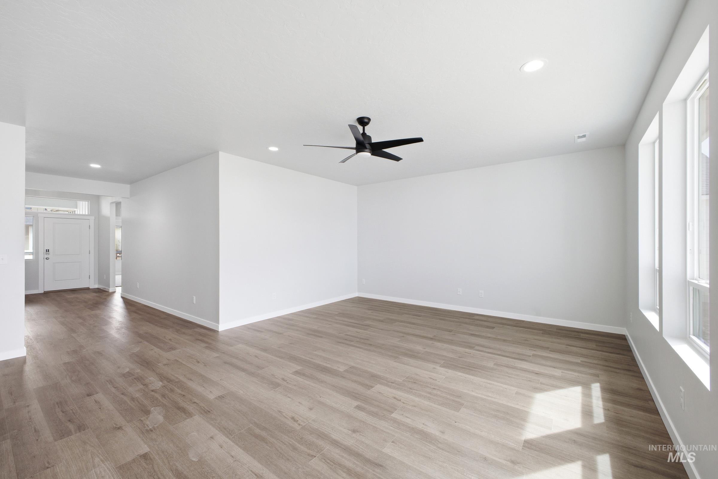 5293 South Memory Avenue Meridian, ID 83642 - Photo 11 of 24 Unfurnished room with a ceiling fan, recessed lighting, and light wood finished floors