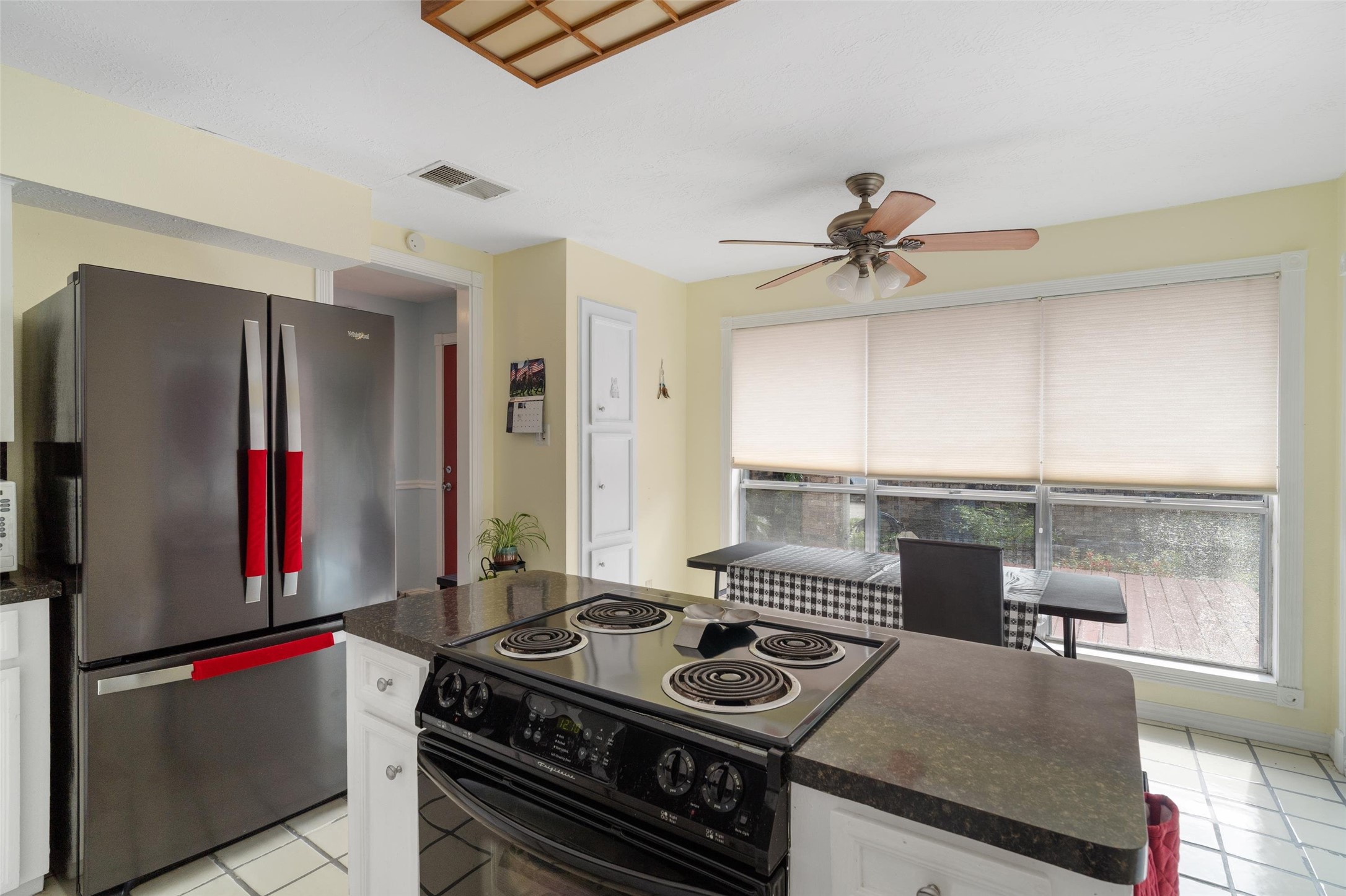 1719 Sullins Way Houston, TX 77058 - Photo 11 of 27 a kitchen with stainless steel appliances granite countertop a stove and a refrigerator