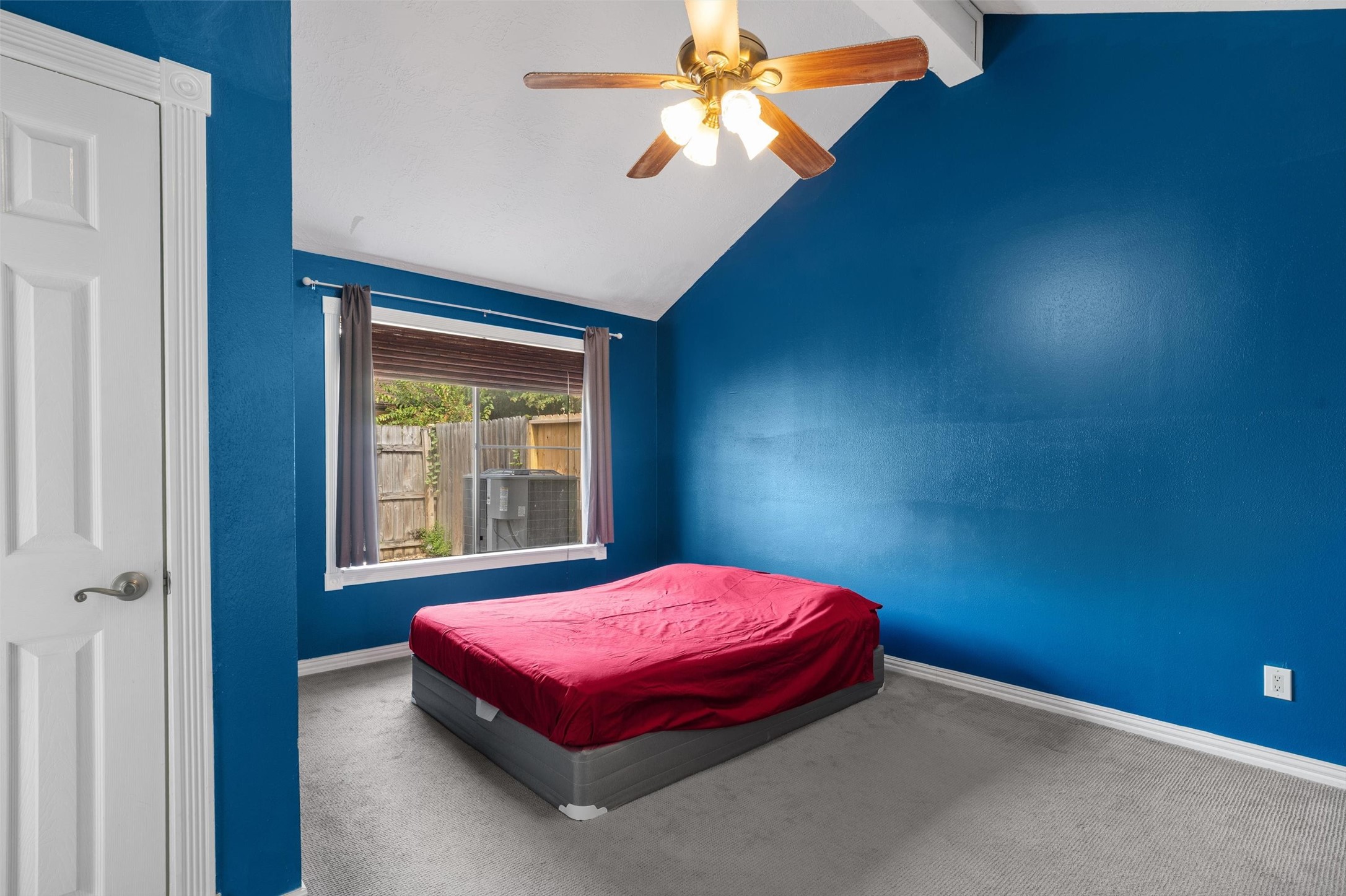 1719 Sullins Way Houston, TX 77058 - Photo 13 of 27 a bedroom with a bed and a chandelier