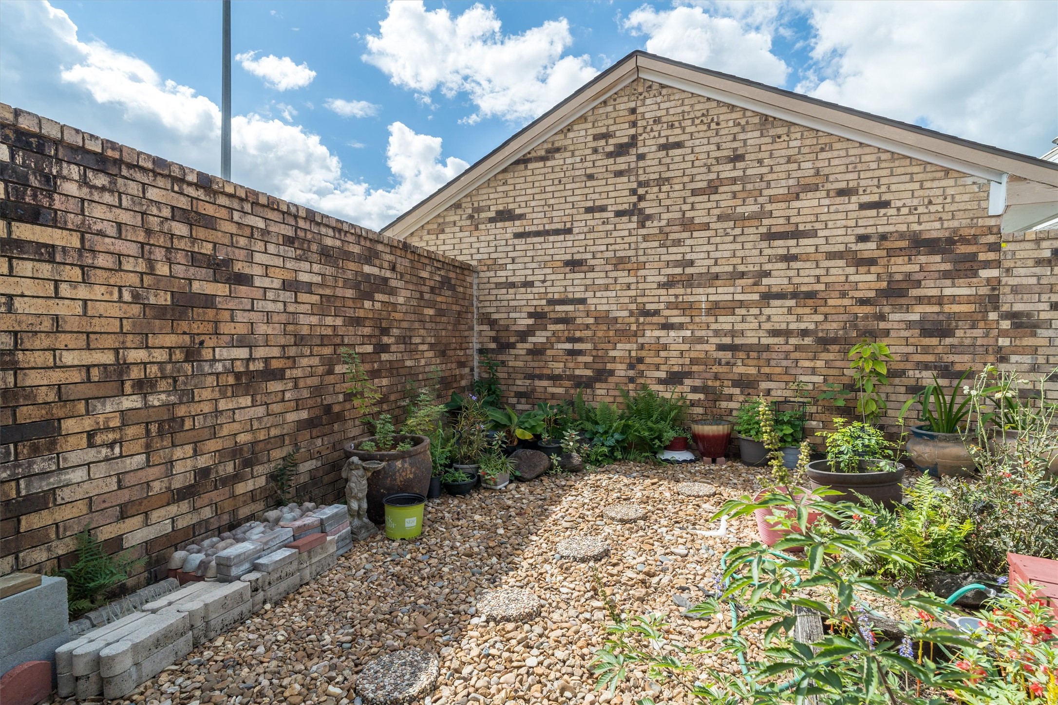 1719 Sullins Way Houston, TX 77058 - Photo 22 of 27 a view of a pathway along a wall
