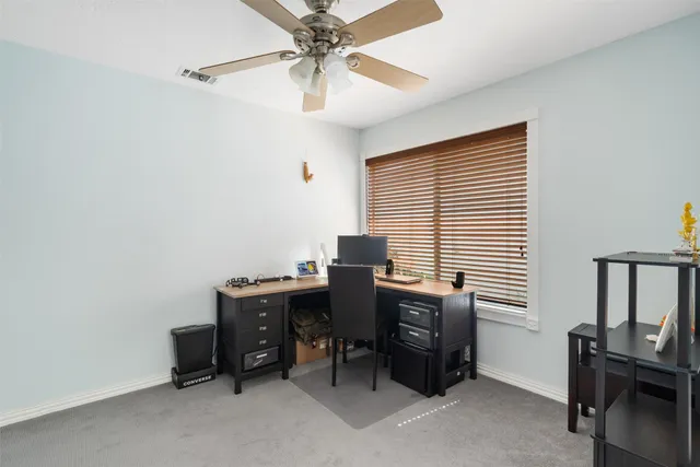 a view of a workspace with furniture