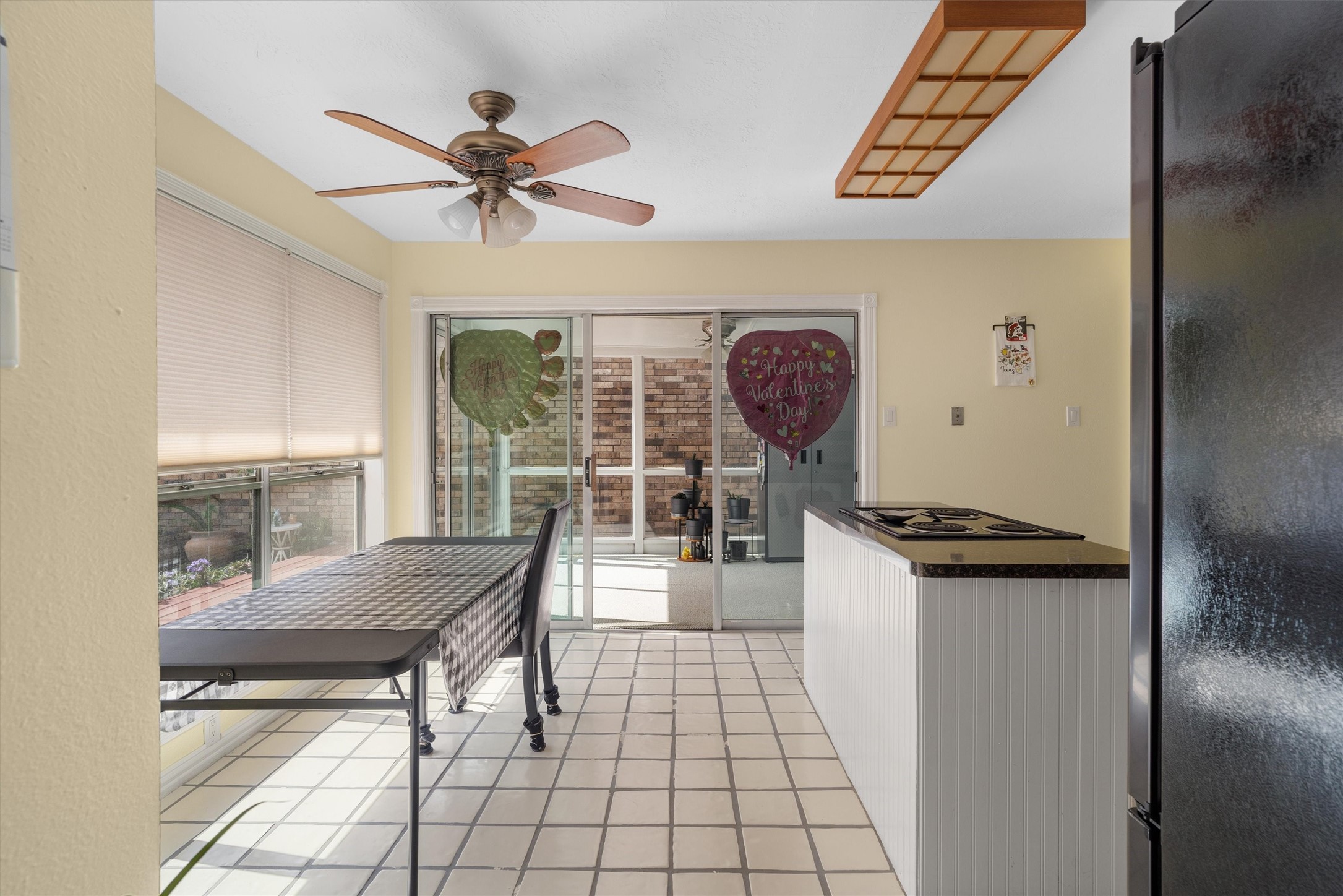 1719 Sullins Way Houston, TX 77058 - Photo 8 of 27 a view of a hallway with wooden floor and a chandelier