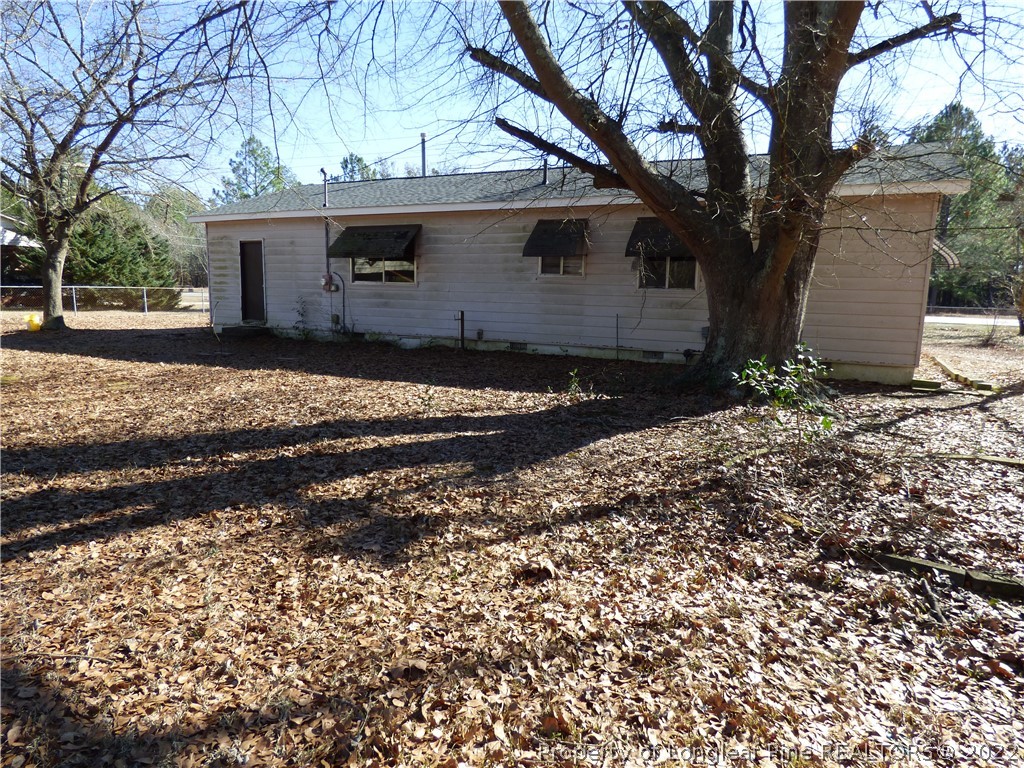 6690 Turnpike Road Raeford, NC 28376 - Photo 12 of 12 a view of a house with a yard