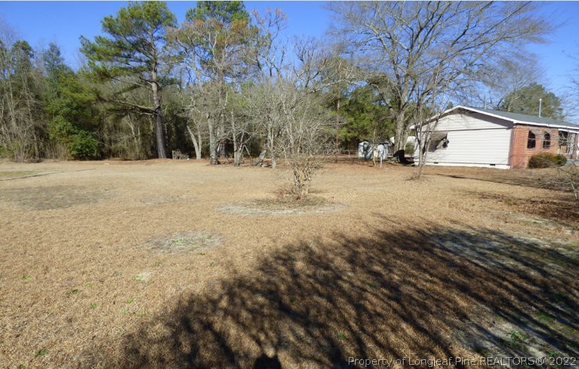 6690 Turnpike Road Raeford, NC 28376 - Photo 2 of 12 a view of backyard of house