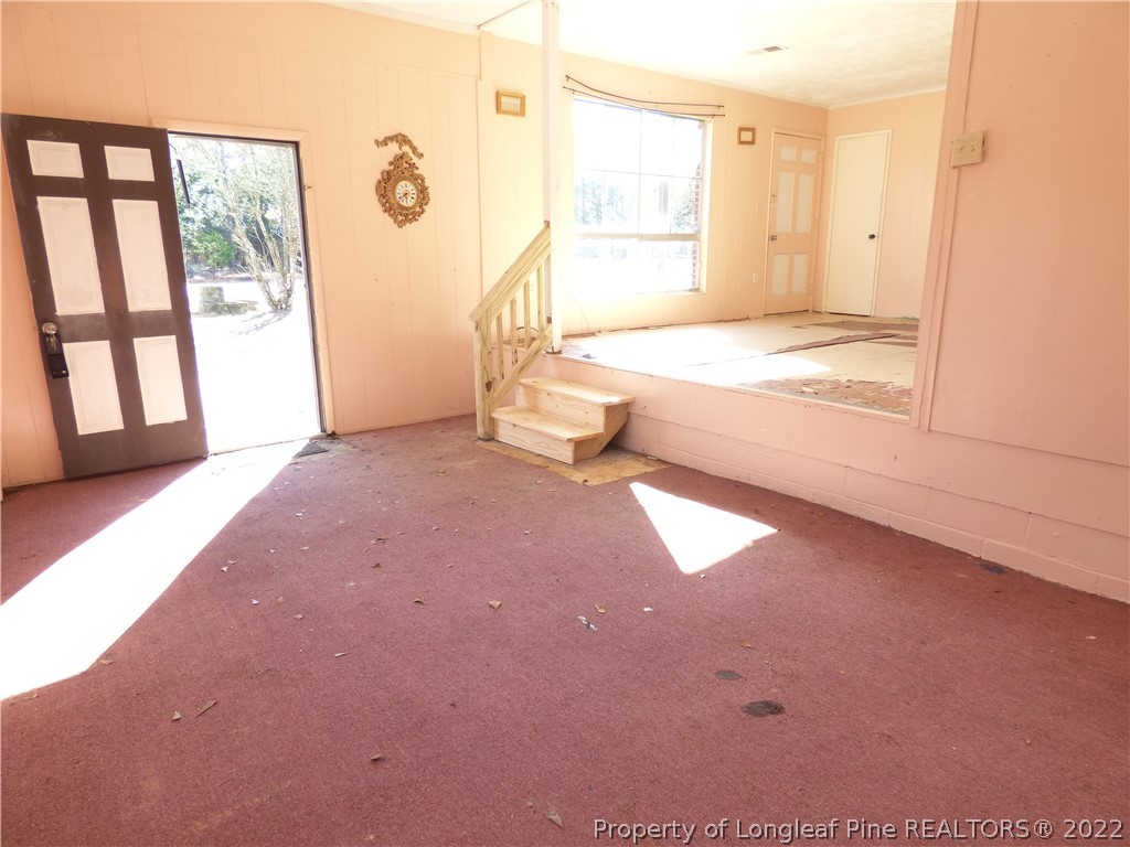 6690 Turnpike Road Raeford, NC 28376 - Photo 3 of 12 a view of an empty room with a window