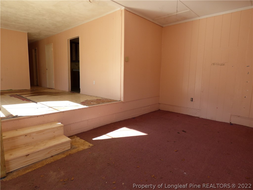 6690 Turnpike Road Raeford, NC 28376 - Photo 4 of 12 a view of an empty room and window