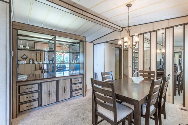 a dining room with furniture window wooden floor