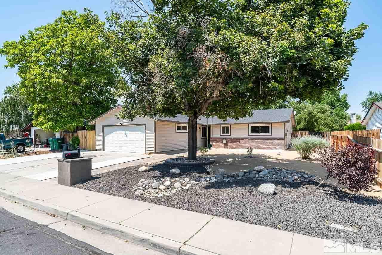2857 Jake Street Reno, NV 89502 - Photo 3 of 22 a front view of a house with a yard