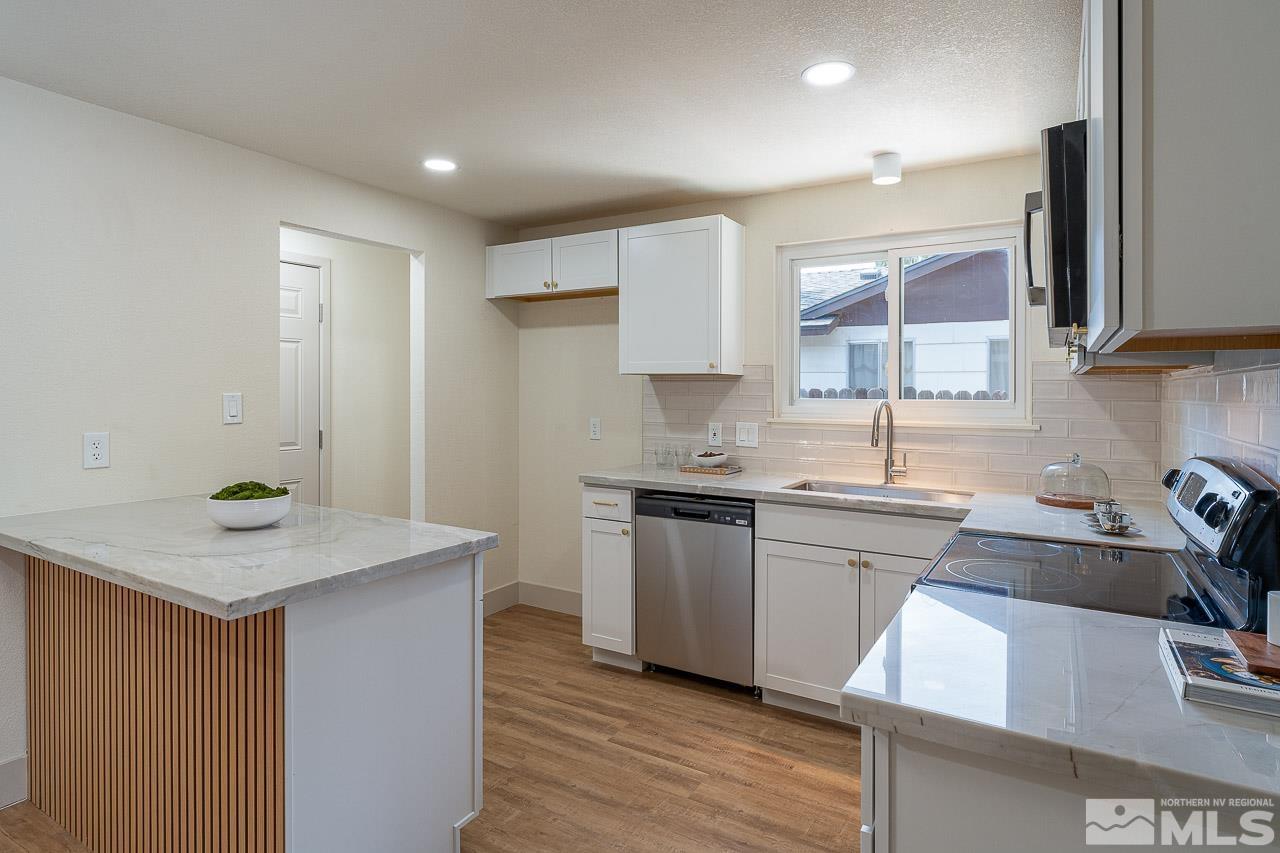 2857 Jake Street Reno, NV 89502 - Photo 6 of 22 a kitchen that has a sink and a stove in it