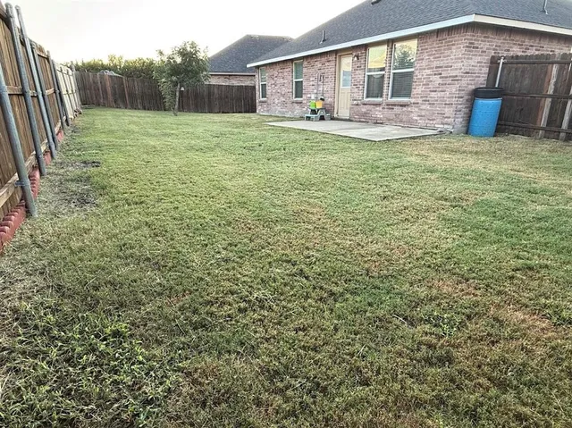 a front view of house with yard and seating area