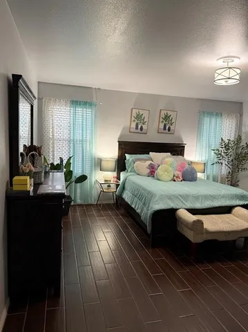 a bedroom with a bed and window