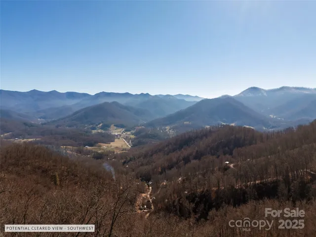 a view of a town with mountains in the background