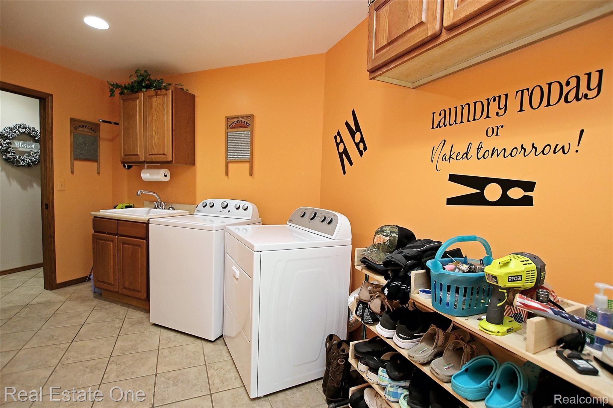 5621 Rochester Road Dryden, MI 48428 - Photo 31 of 52 Laundry Room/ Large tiled mudroom