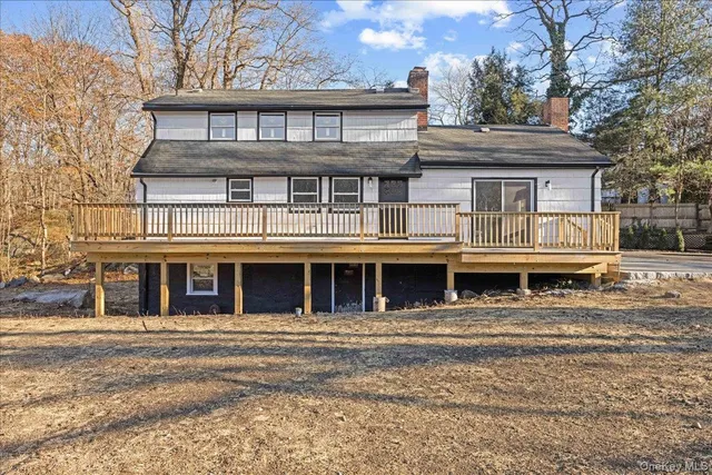 a view of a large building with a large tree