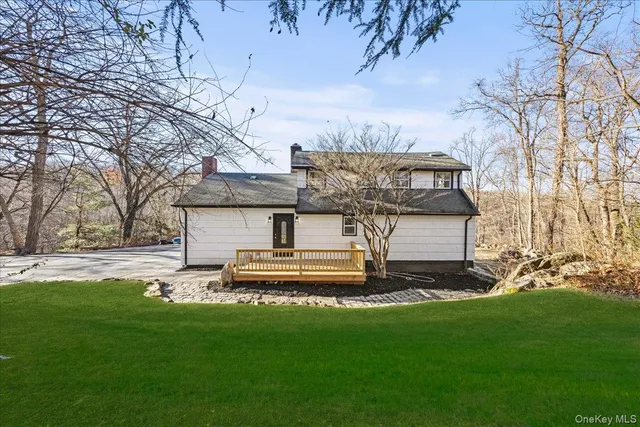 a view of a house with a back yard