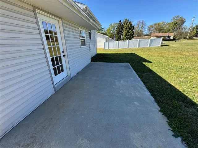 a view of a back yard of the house
