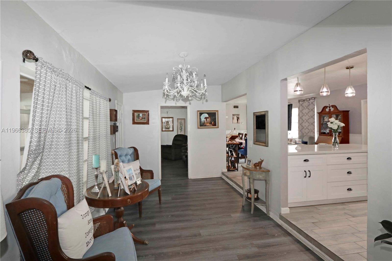 1221 Southwest 74th Court Miami, FL 33144 - Photo 12 of 42 a view of a dining room with furniture and wooden floor