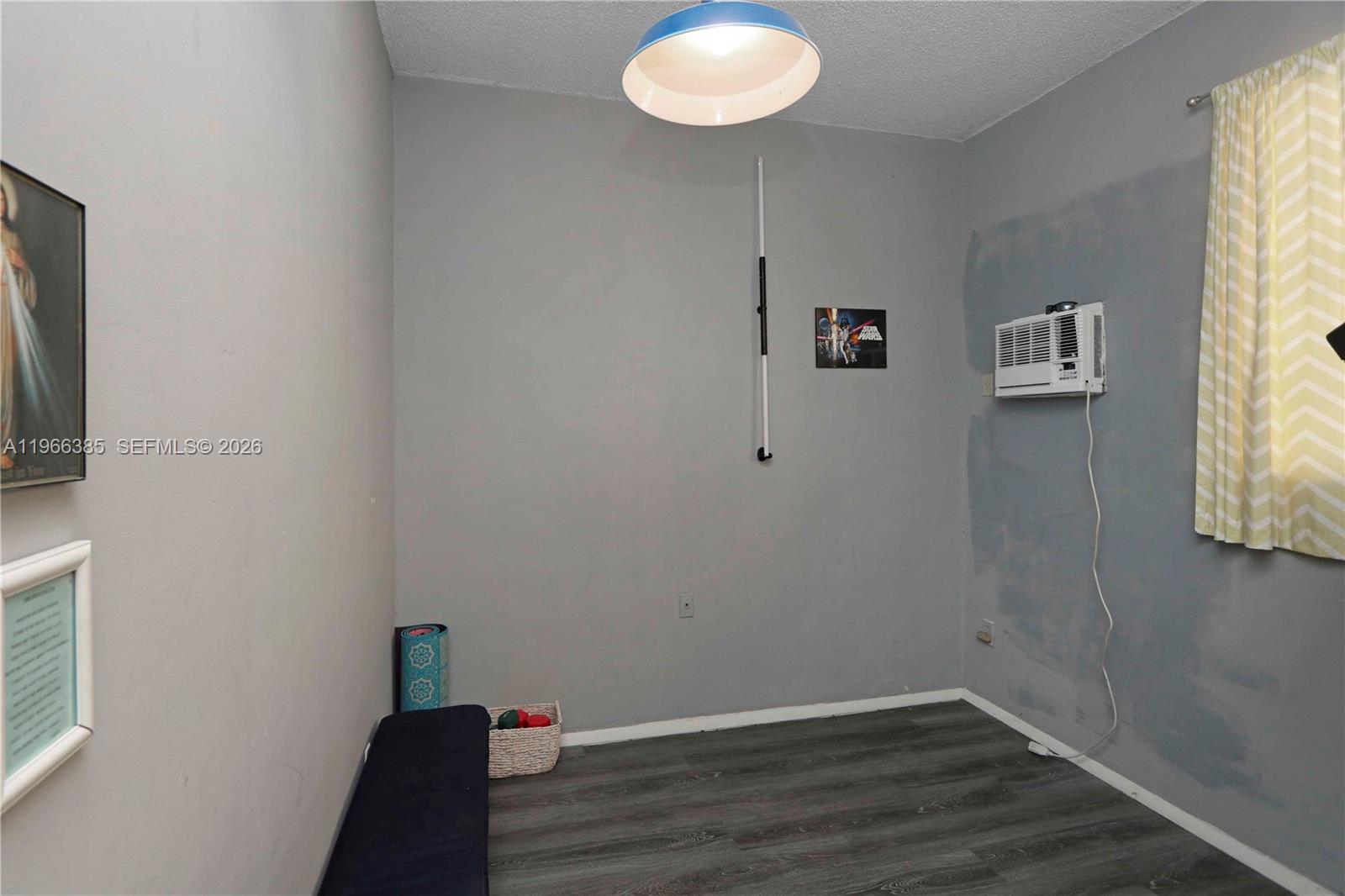 1221 Southwest 74th Court Miami, FL 33144 - Photo 20 of 42 a view of room with hardwood floor and window