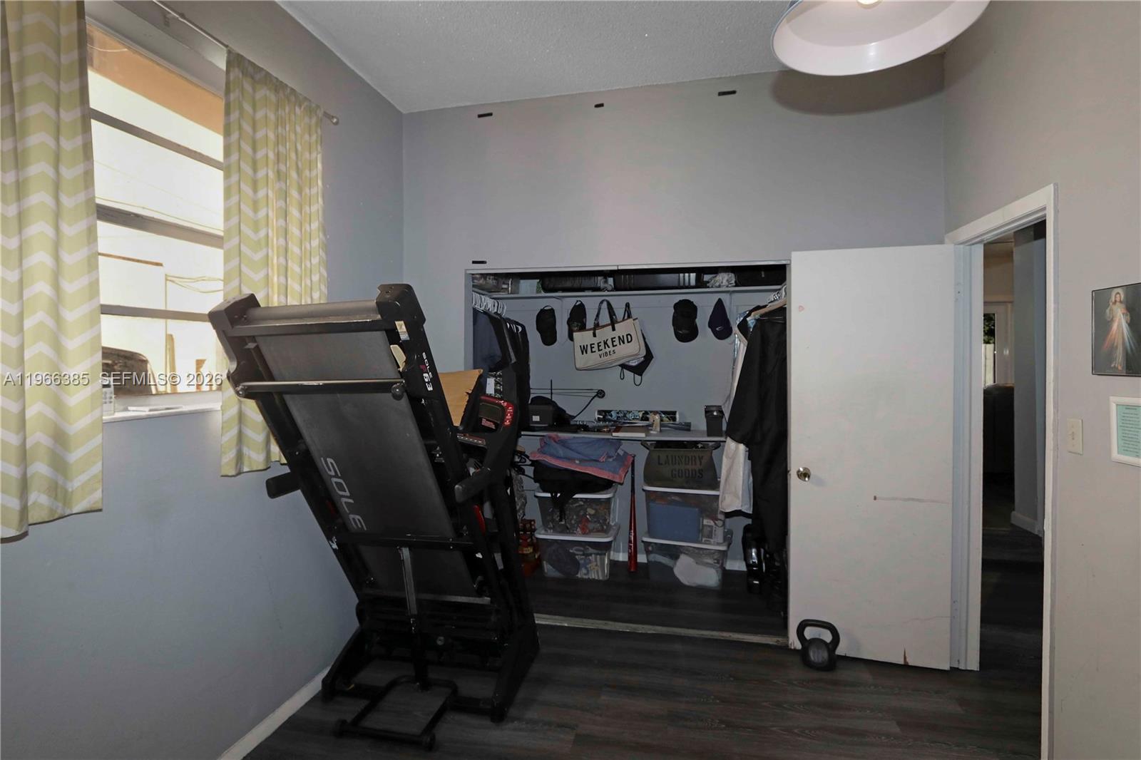1221 Southwest 74th Court Miami, FL 33144 - Photo 21 of 42 a view of a dining room with furniture and wooden floor