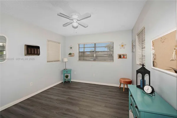 a view of a livingroom with furniture and wooden floor