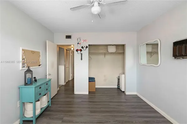 a view of an empty room and wooden floor