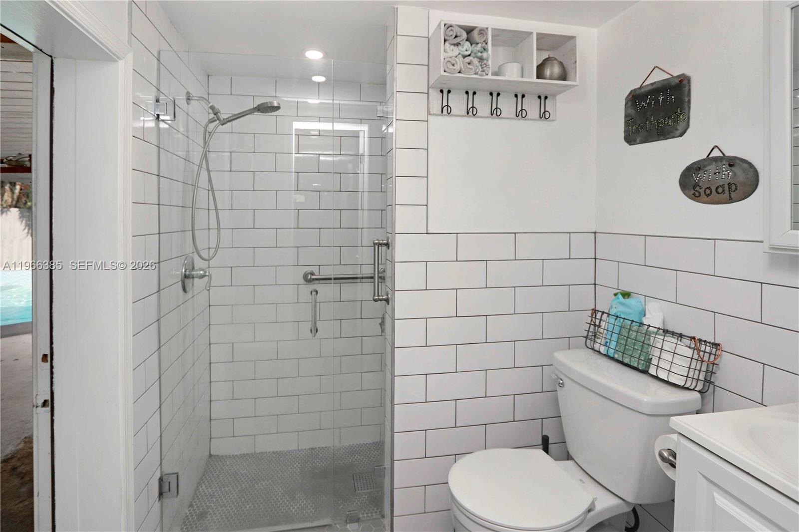 1221 Southwest 74th Court Miami, FL 33144 - Photo 26 of 42 a bathroom with a toilet and a shower