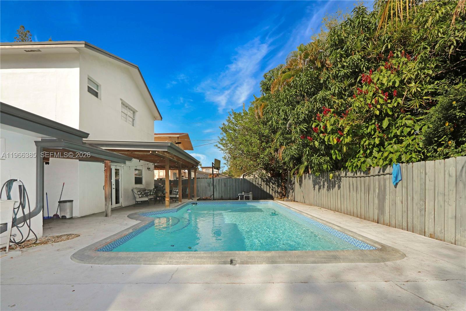 1221 Southwest 74th Court Miami, FL 33144 - Photo 28 of 42 a view of a house with a yard