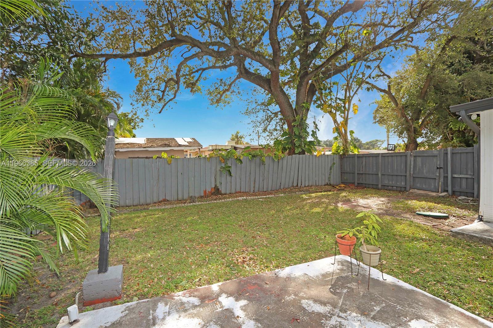 1221 Southwest 74th Court Miami, FL 33144 - Photo 32 of 42 a view of a backyard