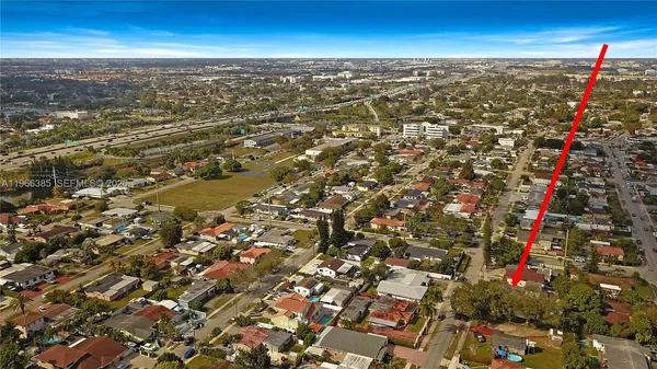 an aerial view of residential houses with outdoor space