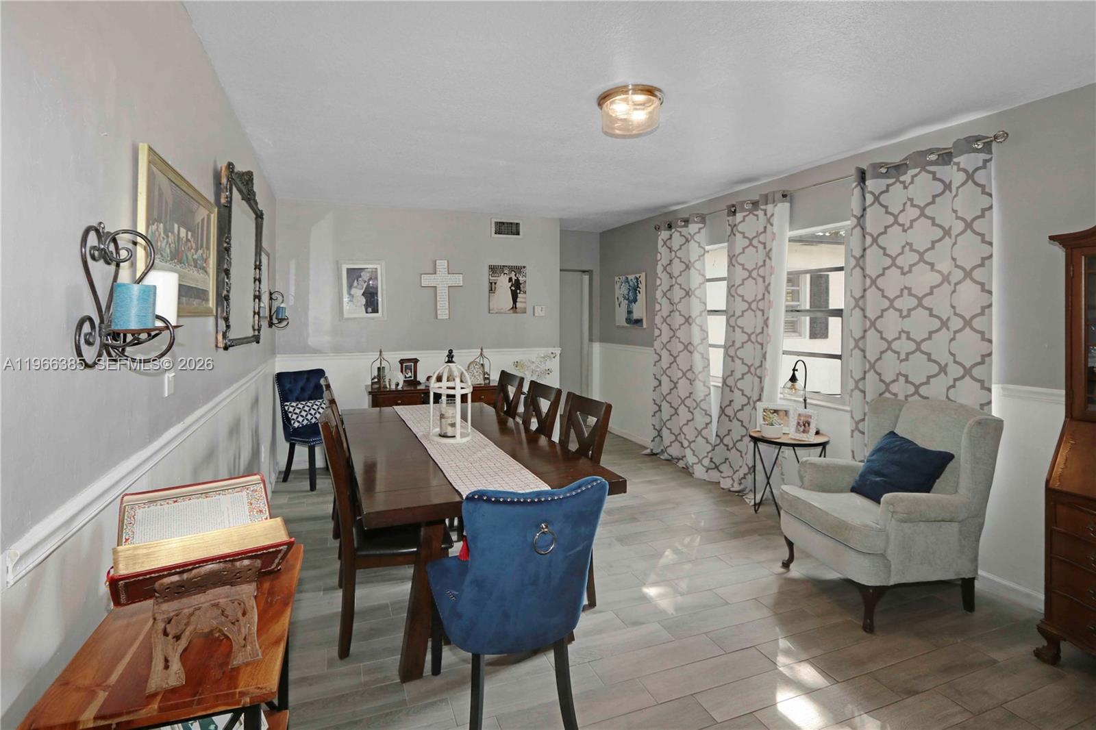 1221 Southwest 74th Court Miami, FL 33144 - Photo 5 of 42 a living room with furniture and wooden floor