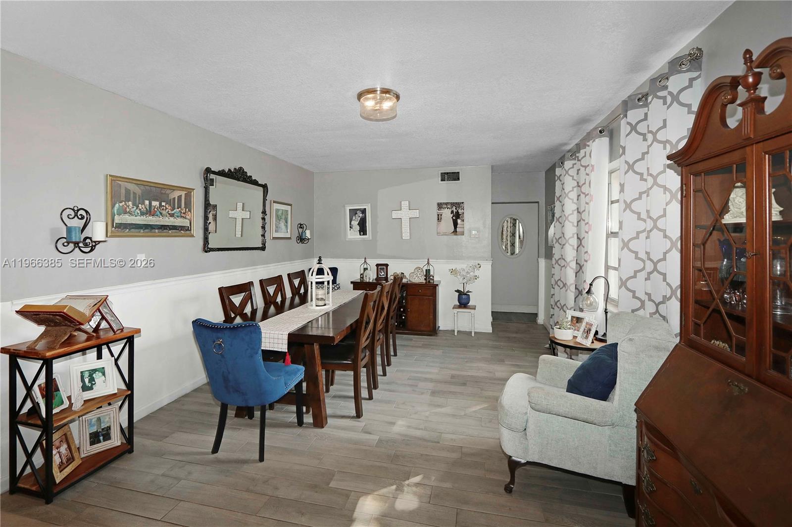 1221 Southwest 74th Court Miami, FL 33144 - Photo 6 of 42 a living room with furniture and a table