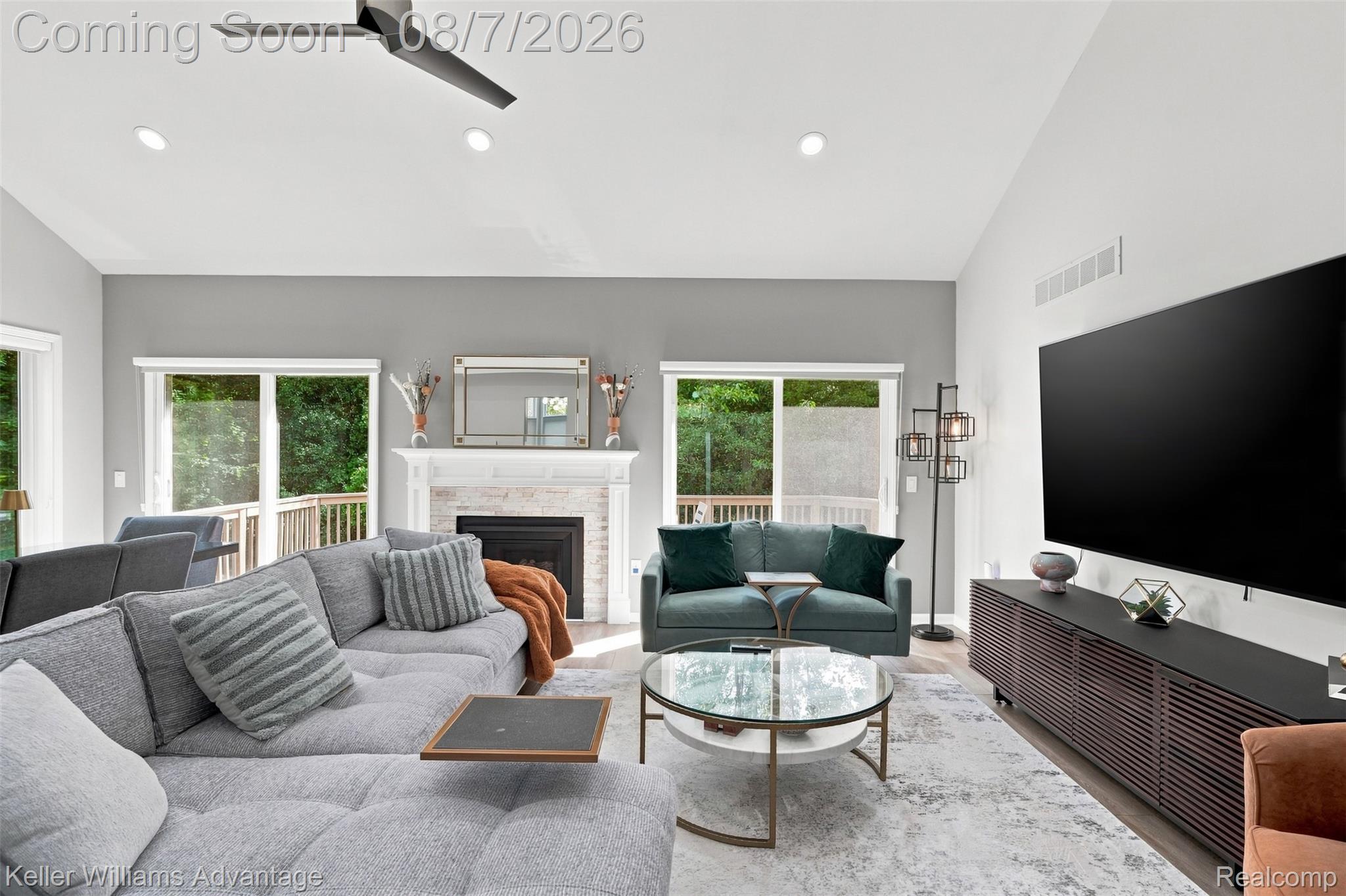 5325 Simpson Lake Road West Bloomfield, MI 48323 - Photo 6 of 43 Living area featuring a ceiling fan, recessed lighting, and a fireplace with a mantel