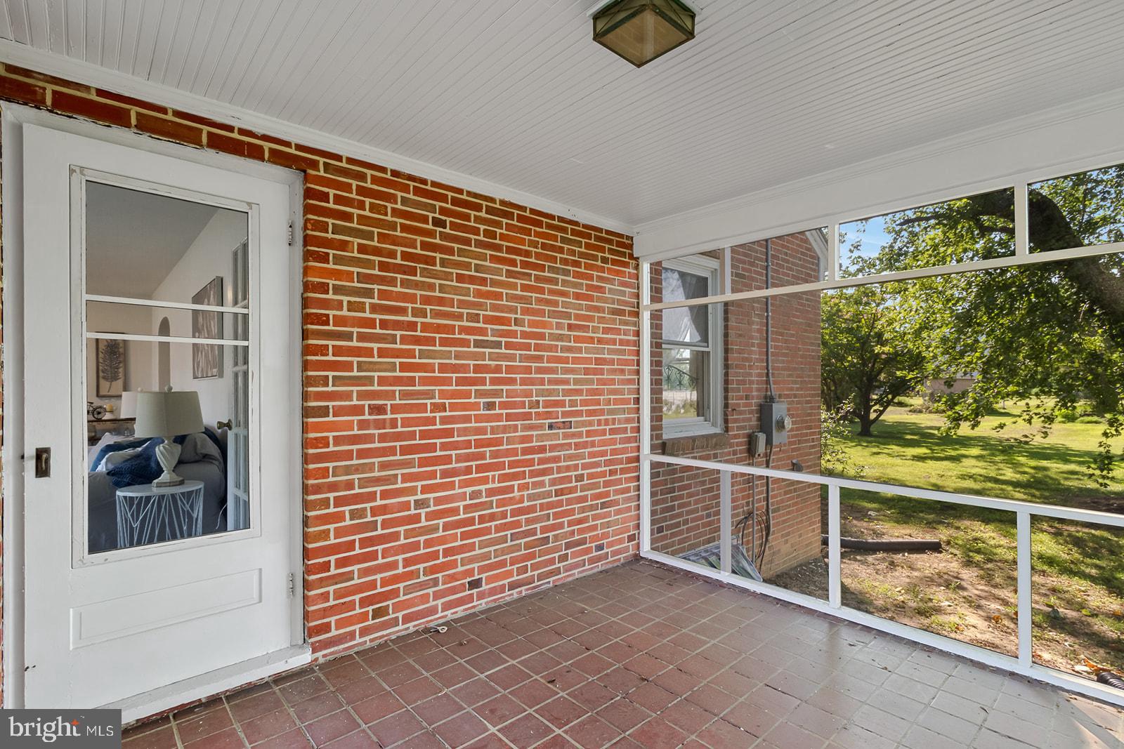 52 Lake Road Lottsburg, VA 22511 - Photo 17 of 42 Private screened porch off living room