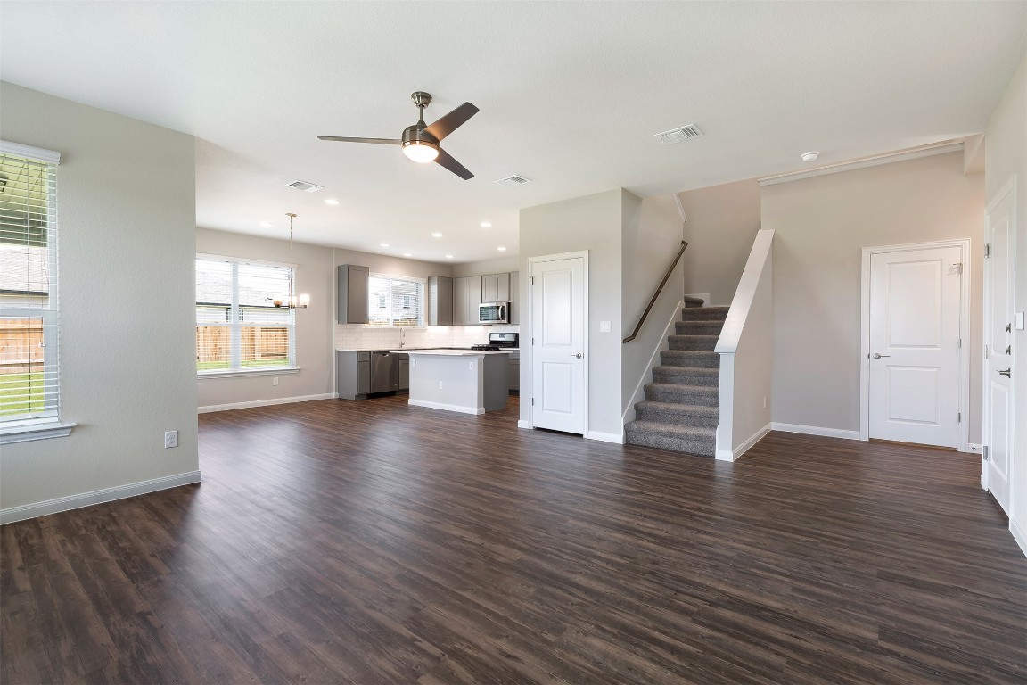 404 San Gabriel River Road Georgetown, TX 78626 - Photo 1 of 6 a view of an empty room with wooden floor and a window