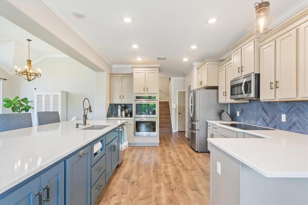 101 Rancho Lorena Drive Lorena, TX 76655 - Photo 17 of 40 a kitchen with stainless steel appliances granite countertop a sink stove and refrigerator