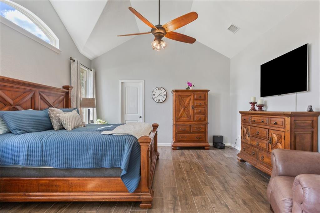101 Rancho Lorena Drive Lorena, TX 76655 - Photo 20 of 40 a bedroom with furniture and a flat screen tv