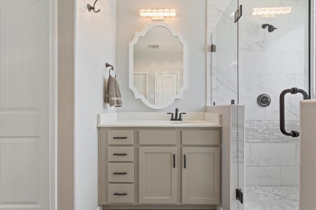 101 Rancho Lorena Drive Lorena, TX 76655 - Photo 23 of 40 a bathroom with a sink vanity and mirror