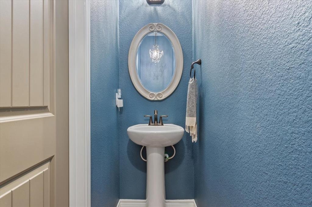 101 Rancho Lorena Drive Lorena, TX 76655 - Photo 25 of 40 a bathroom with a sink and a mirror
