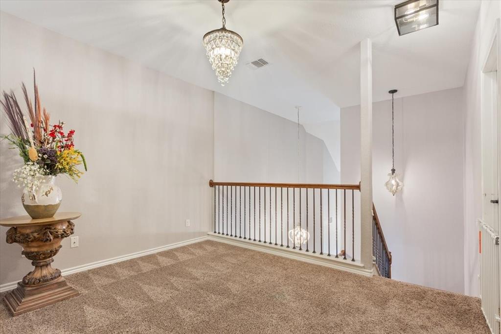 101 Rancho Lorena Drive Lorena, TX 76655 - Photo 26 of 40 a view of a hallway and a chandelier