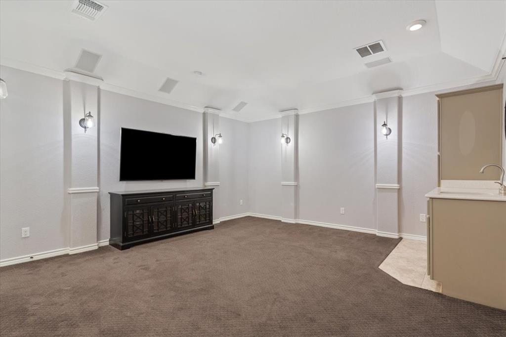 101 Rancho Lorena Drive Lorena, TX 76655 - Photo 28 of 40 a living room with furniture and a flat screen tv