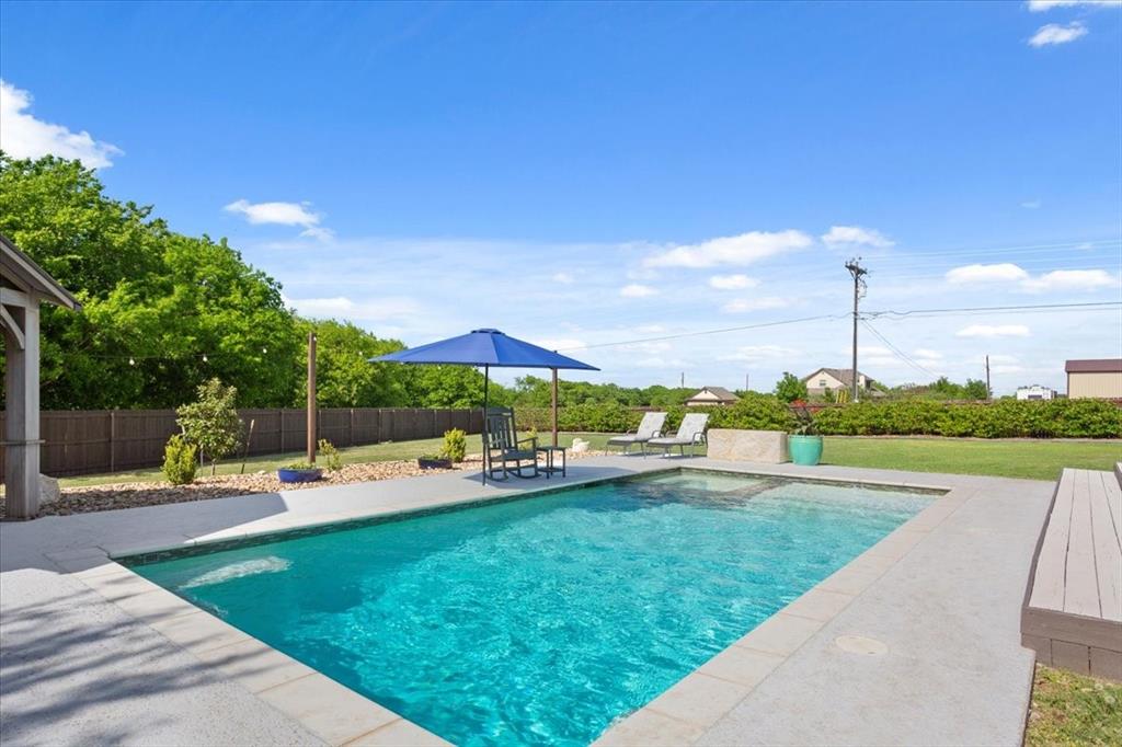 101 Rancho Lorena Drive Lorena, TX 76655 - Photo 36 of 40 a view of a swimming pool with a patio and a yard