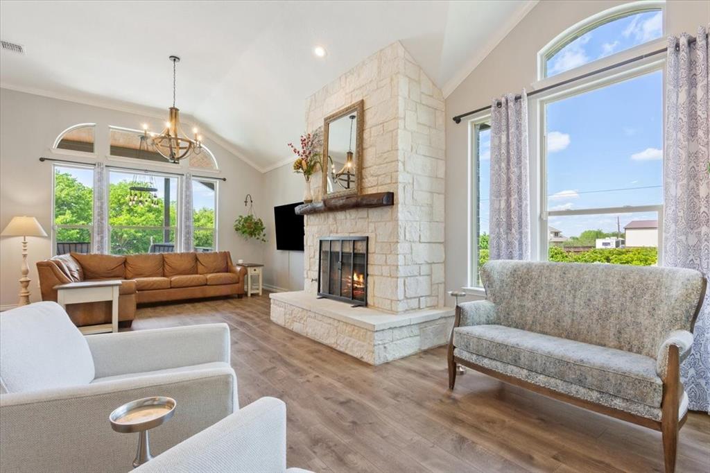 101 Rancho Lorena Drive Lorena, TX 76655 - Photo 5 of 40 a living room with furniture fireplace and a large window