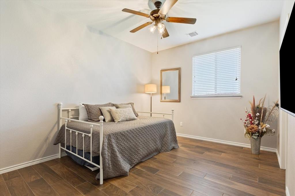 101 Rancho Lorena Drive Lorena, TX 76655 - Photo 10 of 40 a bedroom with a bed and a window